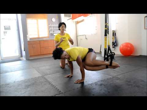 Fitness Culture Minute: TRX oblique crunch exercise